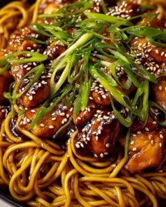 Delicious bowl of chicken teriyaki noodles with colorful vegetables and teriyaki sauce